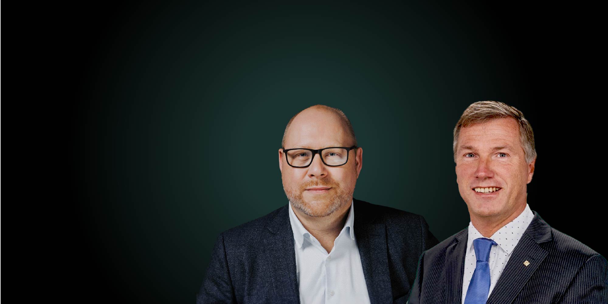 A smiling man dressed in suits